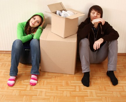 Packed moving boxes and furniture prepared for flat removals in Kentishtown