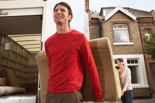 A moving team organizing boxes and furniture for unpacking in Kentishtown