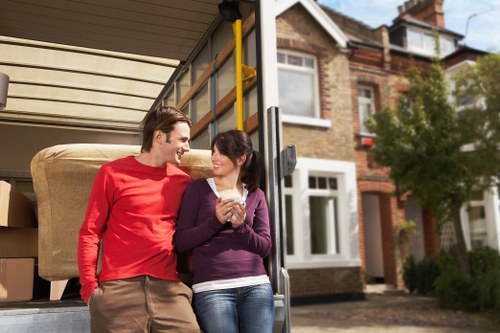 Local removals team handling furniture during a Kentishtown home move